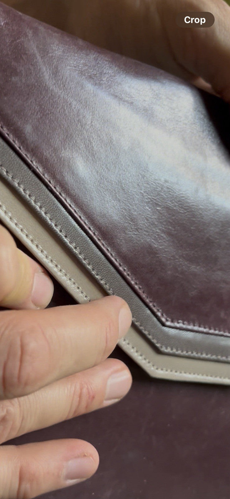 burgundy leather shoulder bag with a  silver accent Caressa Made In Spain