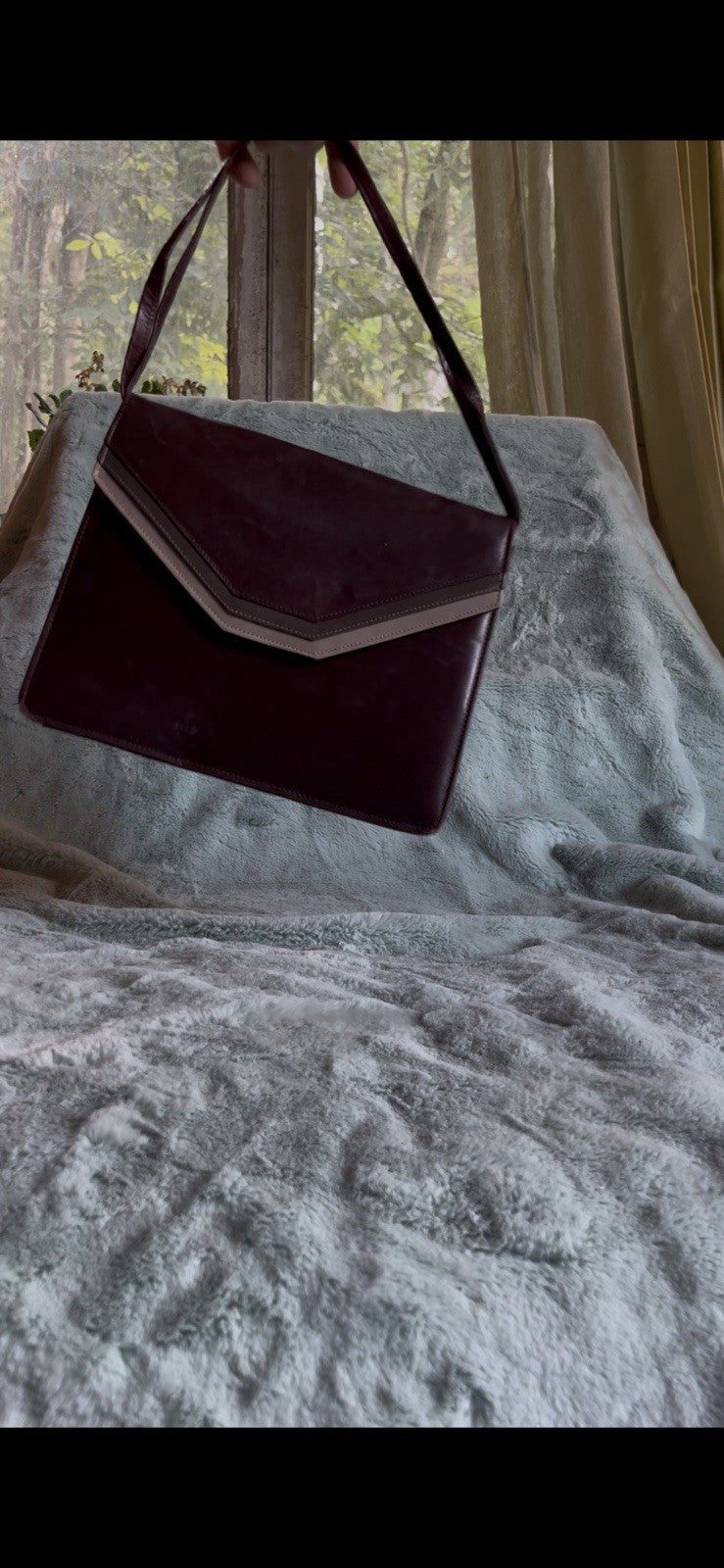 burgundy leather shoulder bag with a  silver accent Caressa Made In Spain