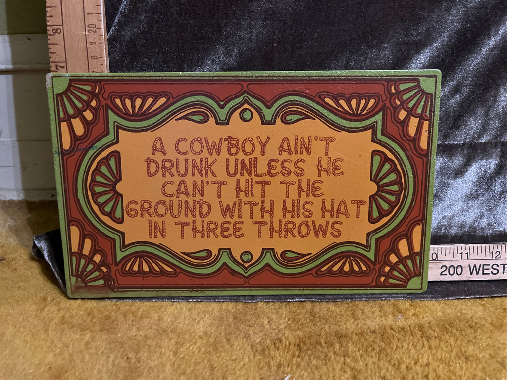 A cowboy ain’t drunk unless he can’t hit the ground with his hat sign pf